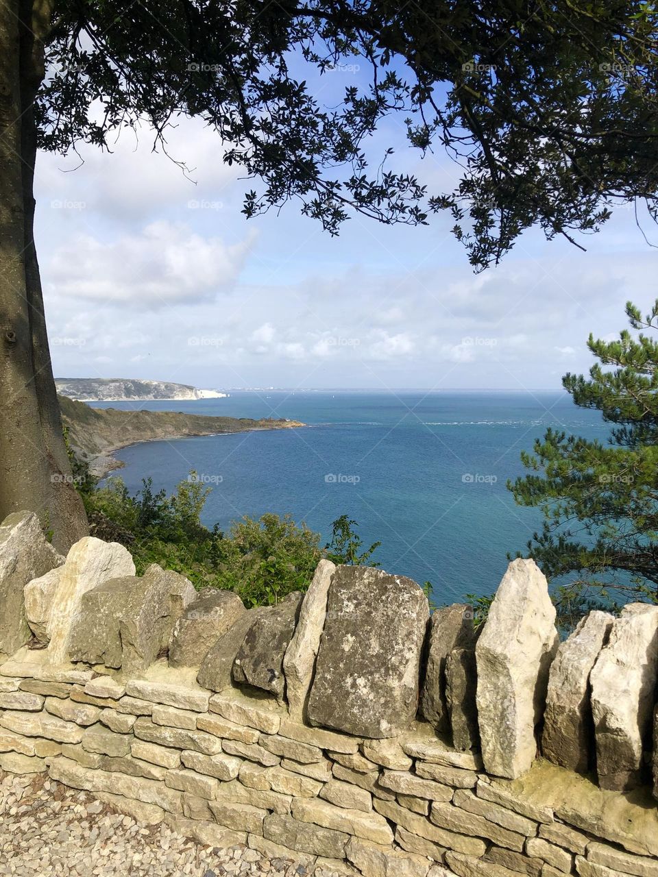 Sea view over stone fence