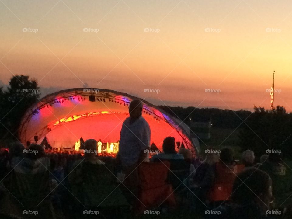 Concert stage. Hot Air Balloon inflating above Conner Prairie. 