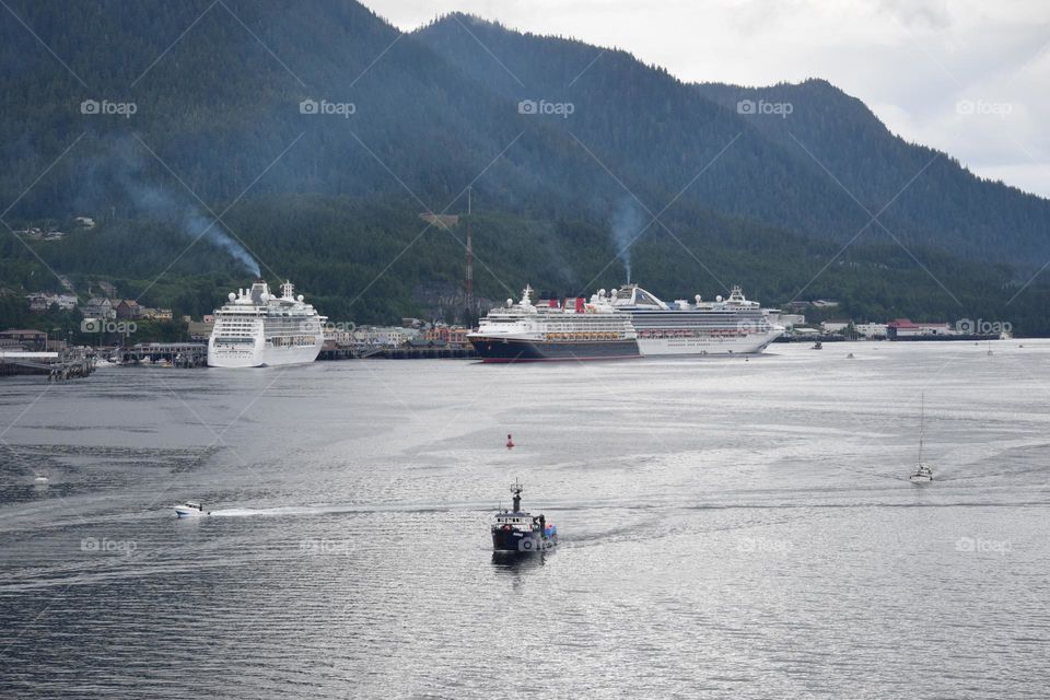 Several cruise ships crowd a Alaskan port
