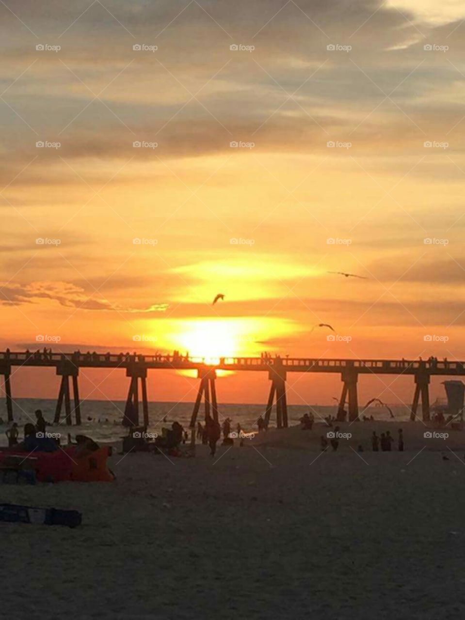 beach pier sunset