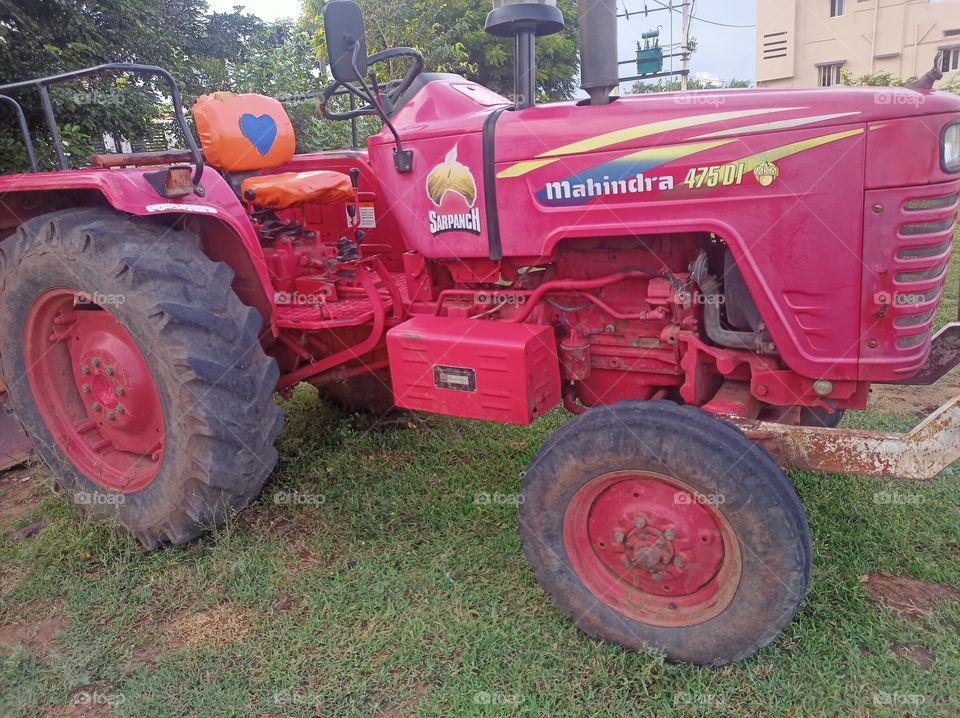 colour red - red colour tractor in the outdoors