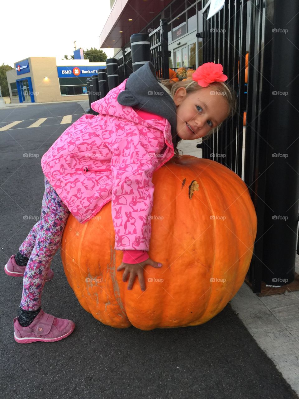 Cute girl with pumpkin