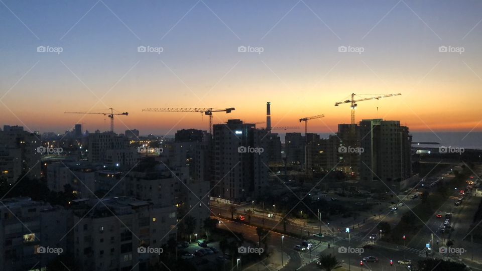 A beautiful Tel Aviv sunset, skyscrapers, city, view, buildings, lights, roads  
