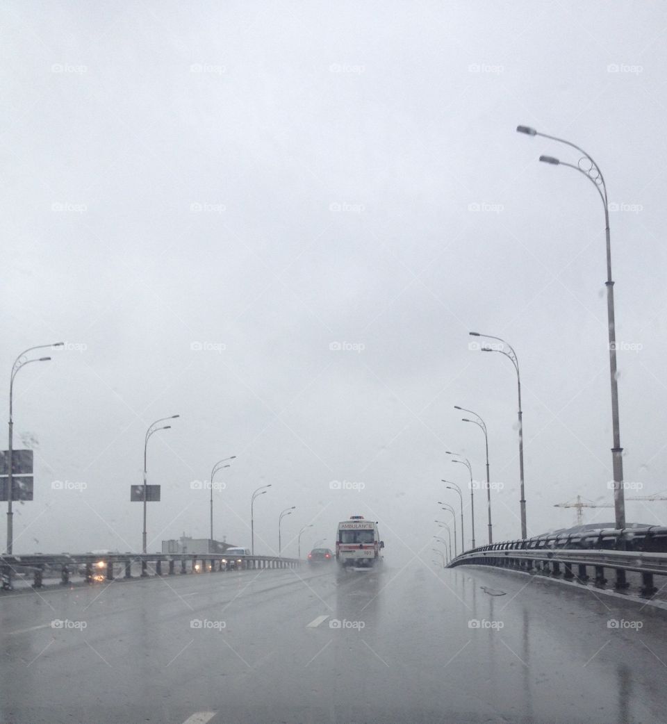 Ambulance on the road in the rain