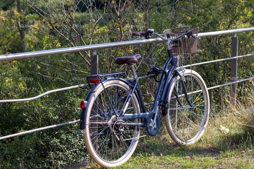 An blue lonely bicycle