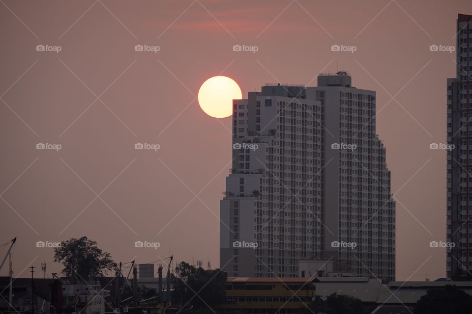 Sunset behind building