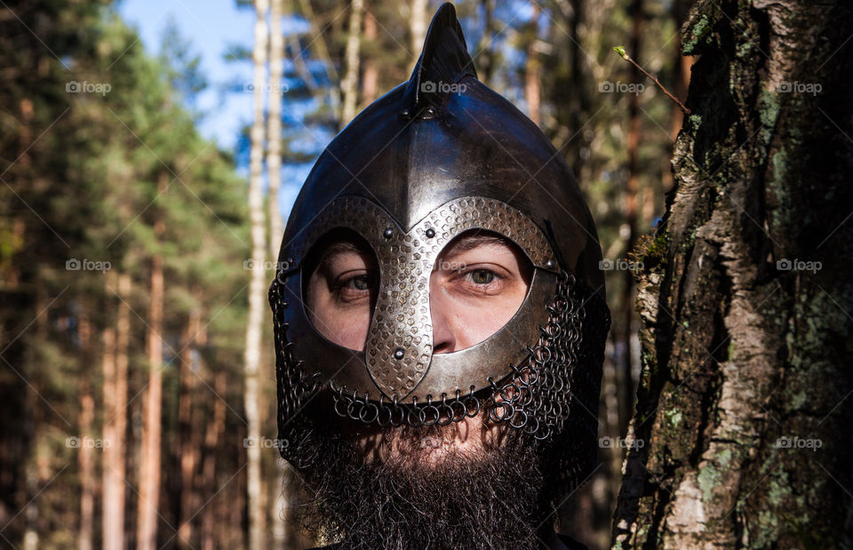 Bearded viking in the helmet. History reconstructor