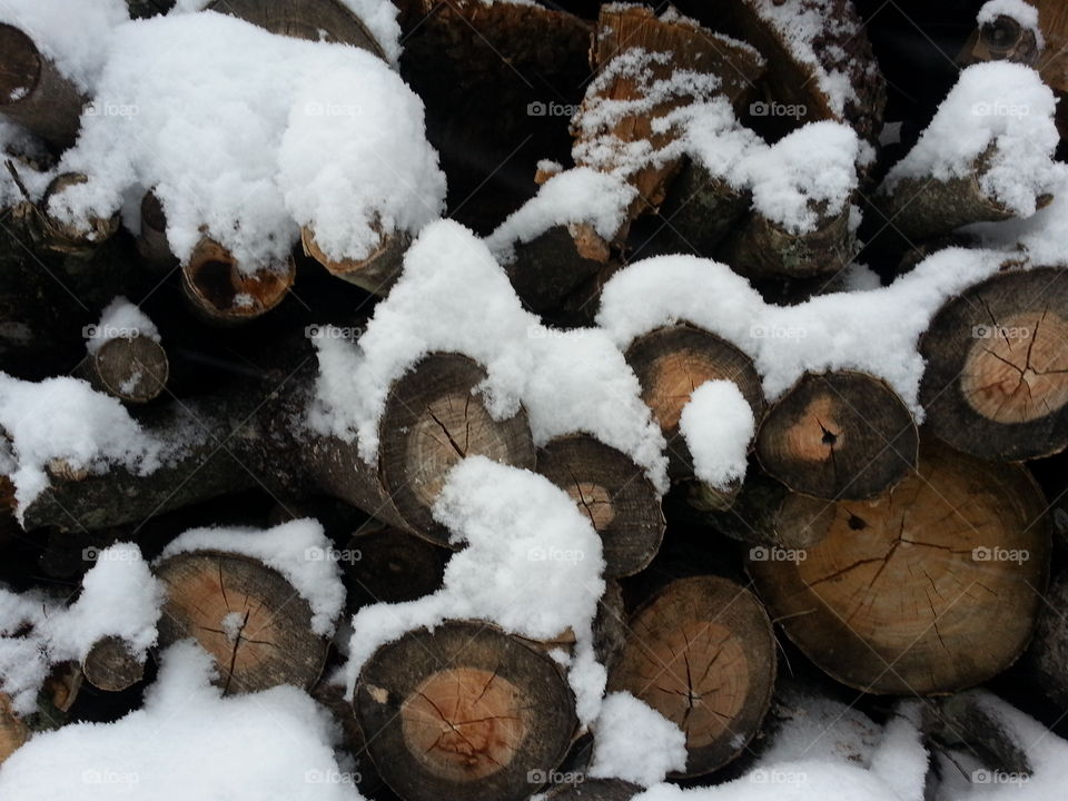 Snow covered wood pile. Snow covered wood pile.
