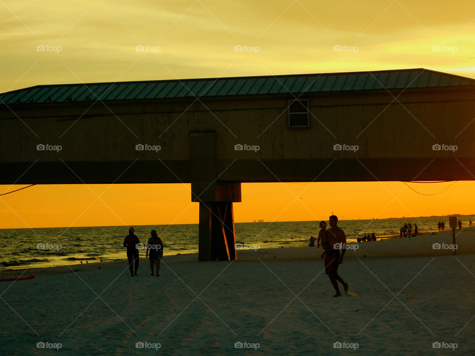 The sun shone brilliantly and the water in the ocean glittered invitingly! A golden glow spread across the sky as the sun chased the dark clouds away! The sunset is free, so go outside and capture it!