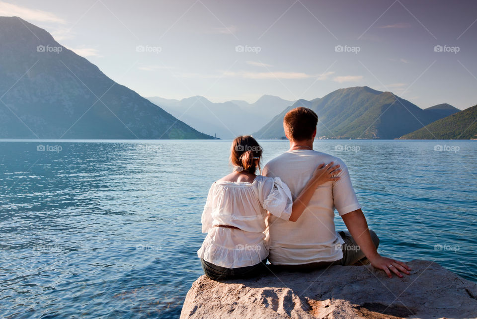 Couple on the bay at sunrise