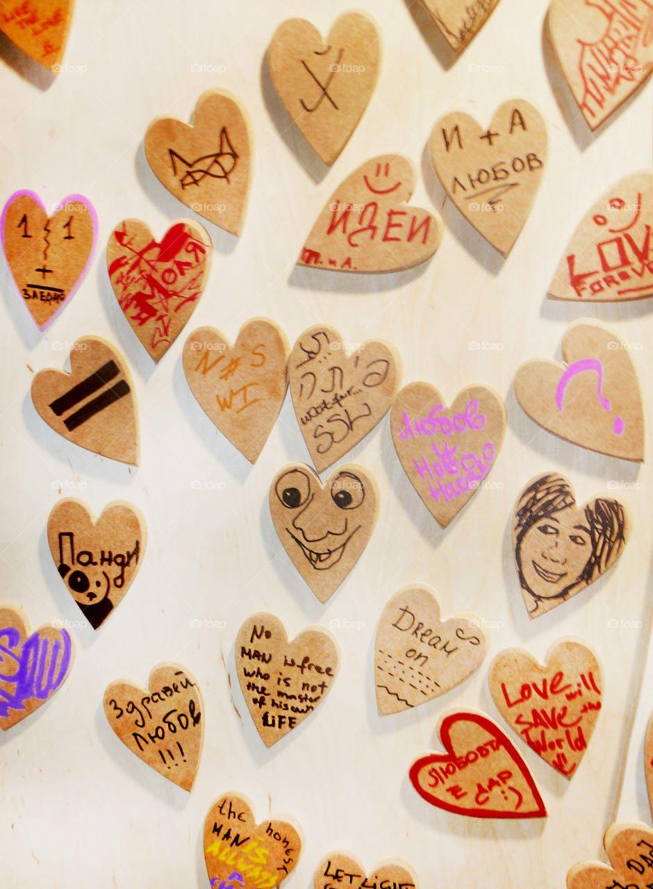 wooden love cards on the wall, heart shape