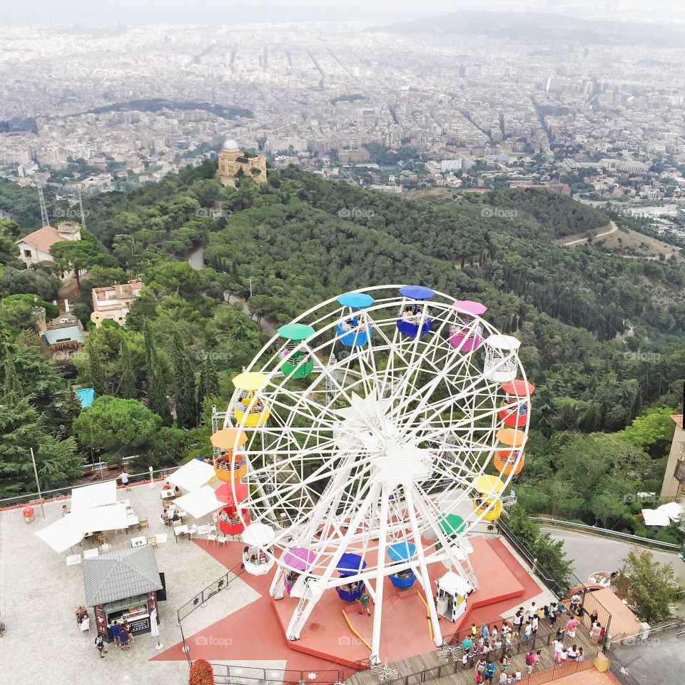 Fun fair. The wheel and the landscape