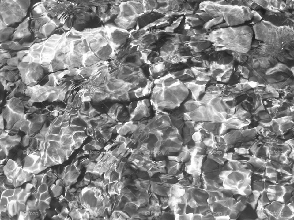 Black and white rock under water