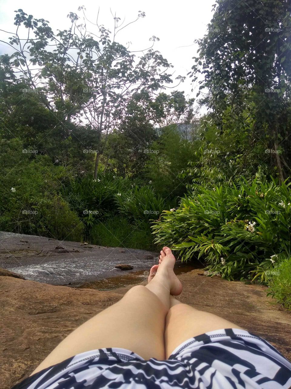 Laying near a Waterfall in summer time in Brazil