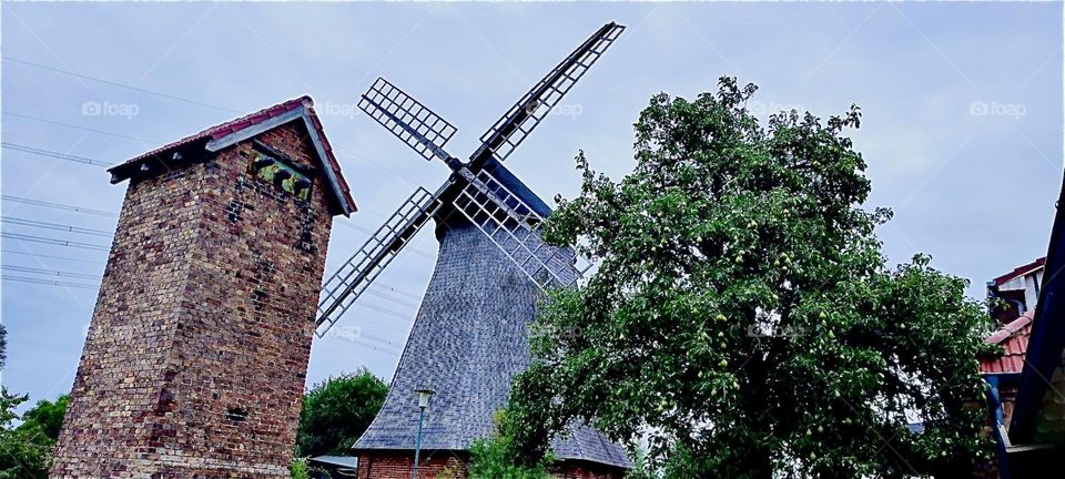 This a windmill located in “Rostock” by the “Baltic Sea” in former “East Germany”. It now houses a restaurant which is all the more popular during the “Hanse Sail”, a big annual regatta held in August. 2023. Hypnotic Productions