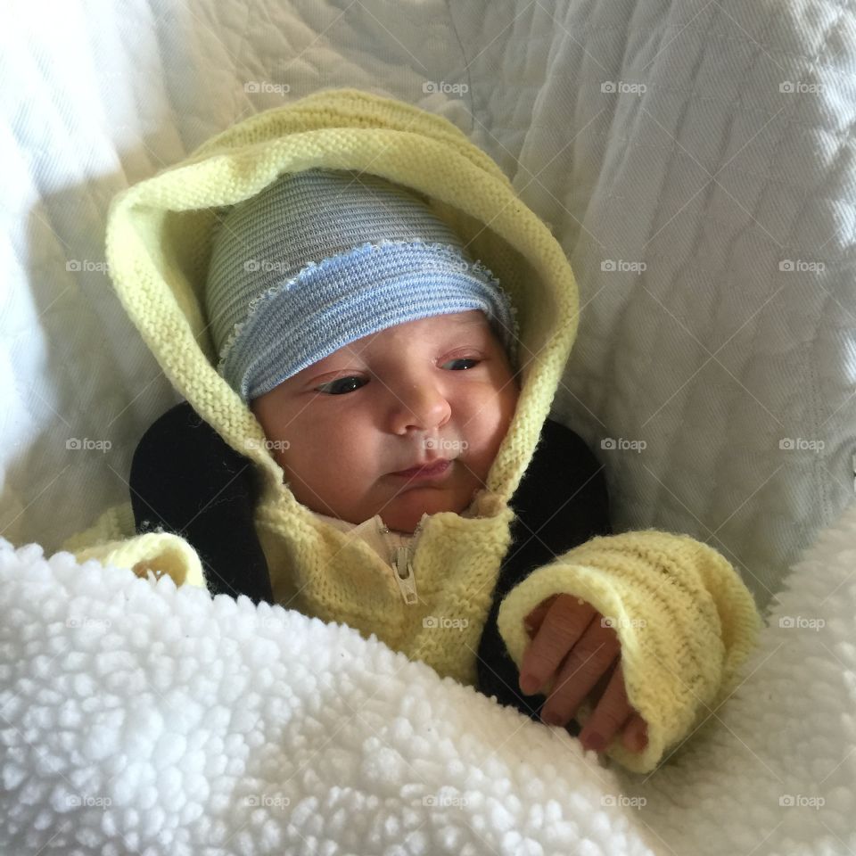 Close-up of cute baby in blanket
