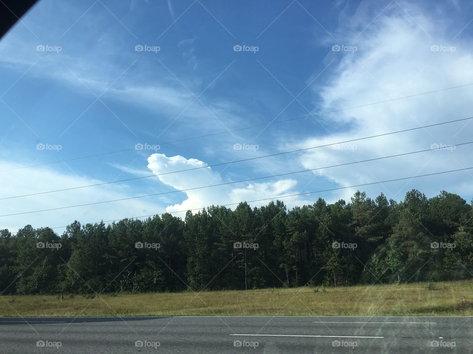 Clouds seen from car window.