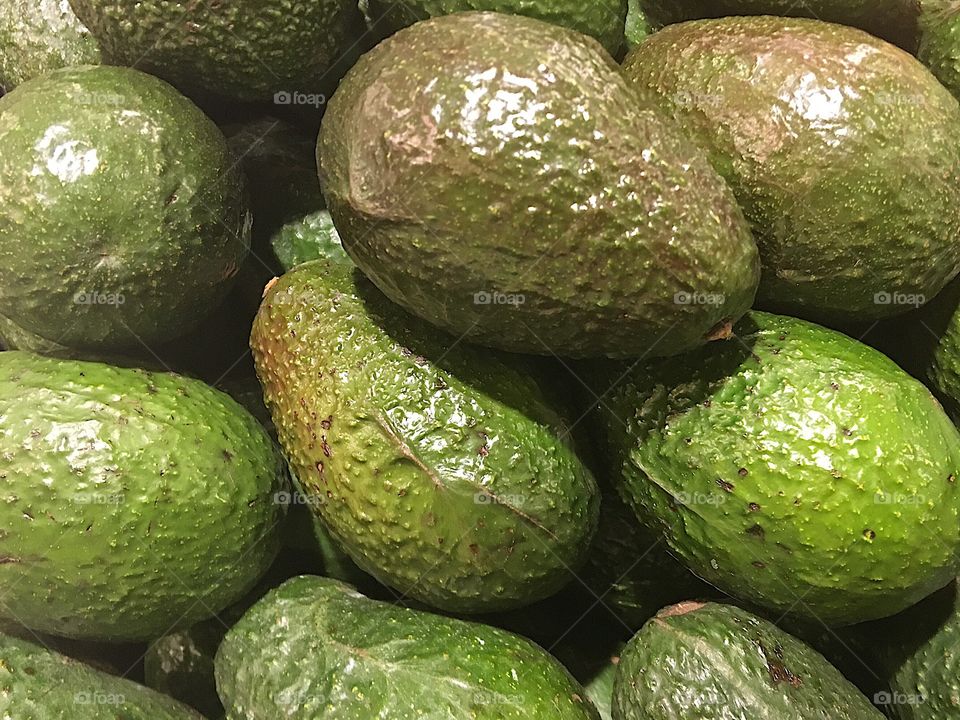 Avocados up close in a supermarket. 