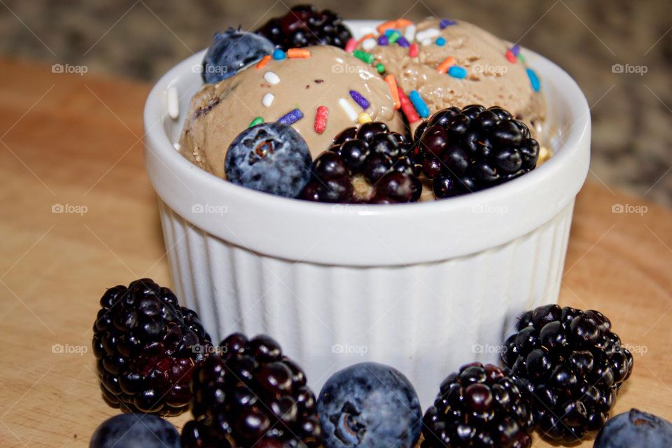 Chocolate ice cream with blue and black berries