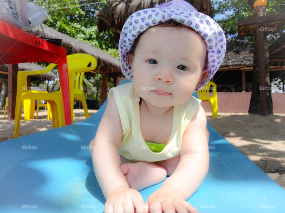 Portrait of baby girl sitting at park
