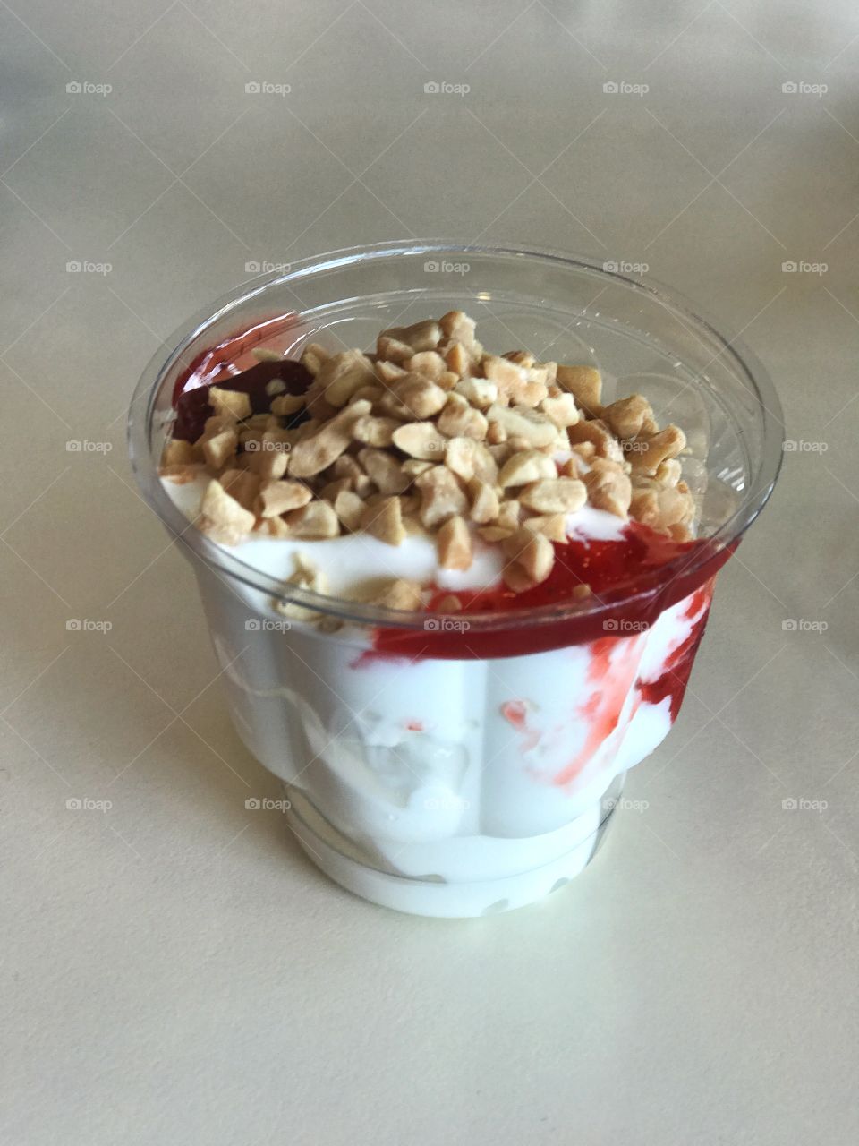 Ice Cream with strawberry jam and nuts