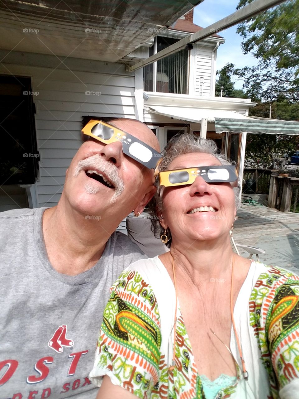 Man & Woman watching total
 ECLIPSE of Sun.