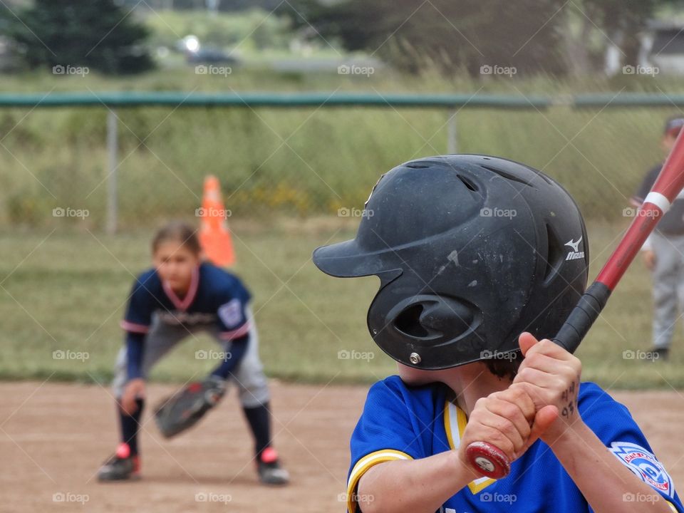American Little League. Boy And Girl Playing American Little League Baseball
