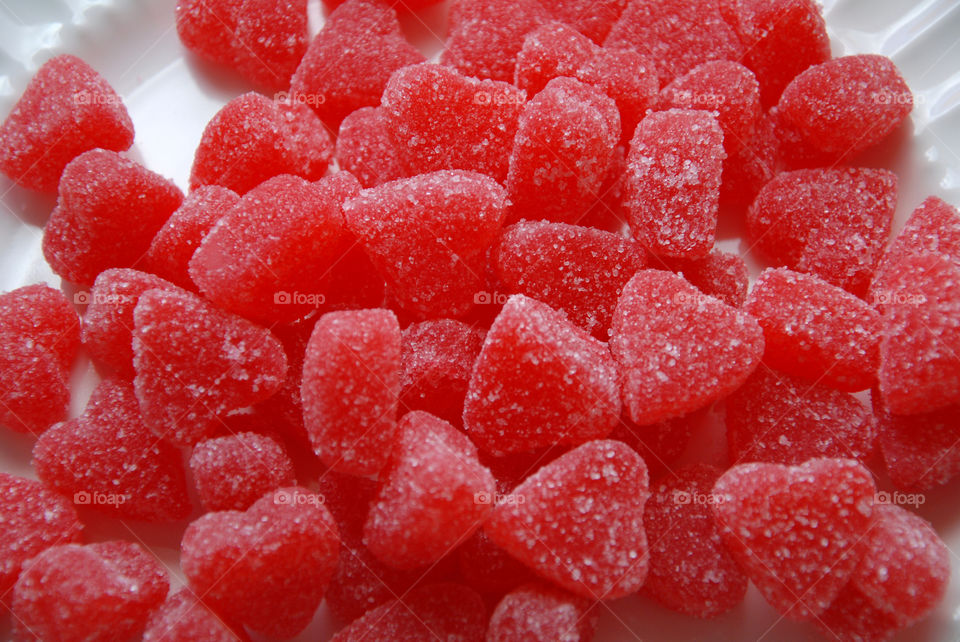 A plate full of red and sweet heart shaped candies!