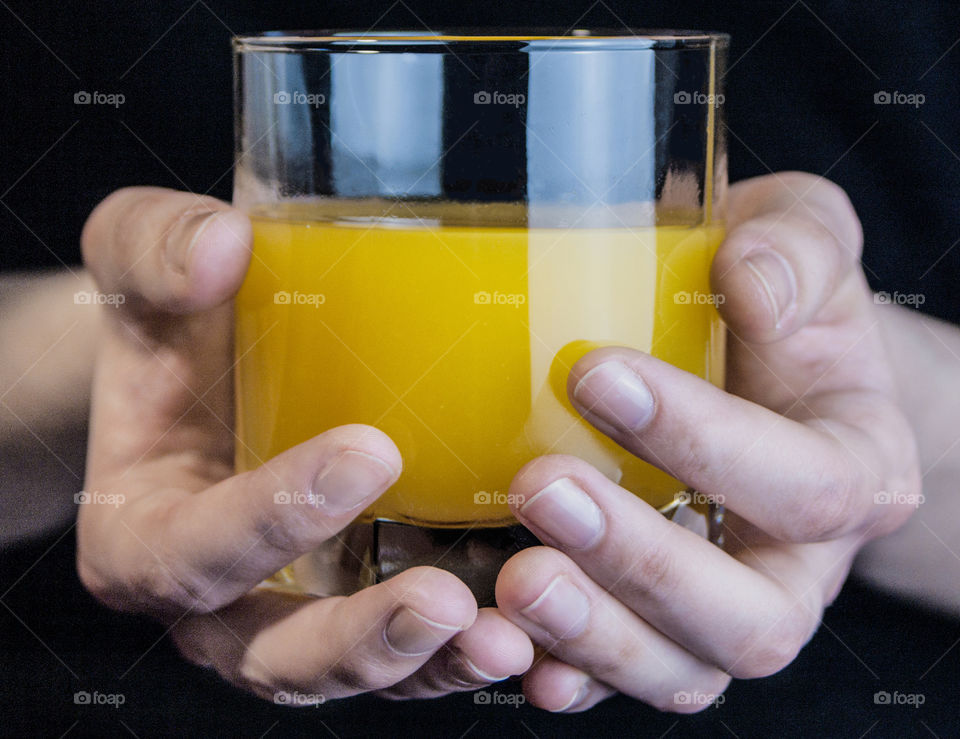 Juice and fruit in the hands of a girl