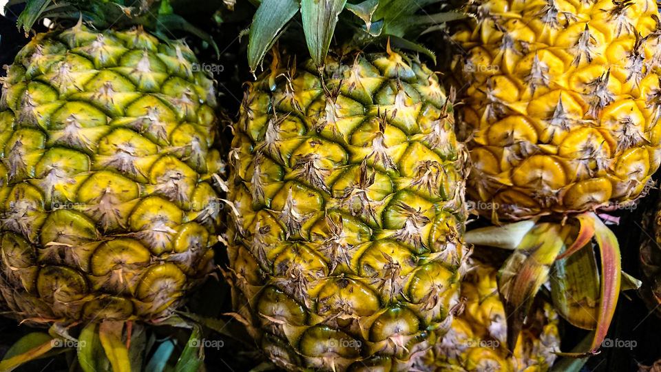 Pineapples for sale at the fruit market.