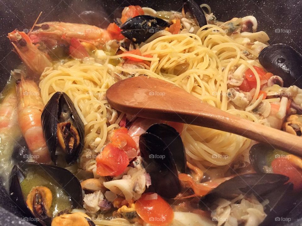 Typical italian main course, noodles with seafood