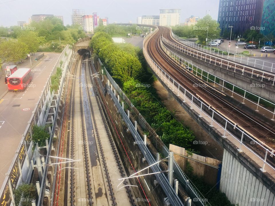 View east from Prince Regent station on the Docklands Light Railway, London, in Spring. Showing the current raised track, the new Crossrail tracks and tunnel entrance.