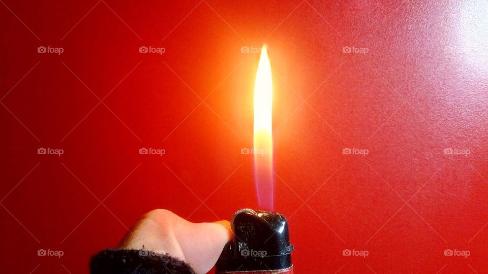 gas lighter on a red background