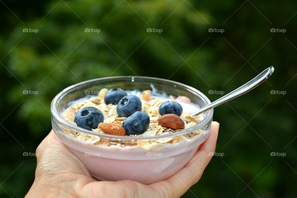 healthy food in the hand green summer background tasty