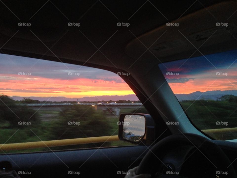 Sunrise inside a car. 