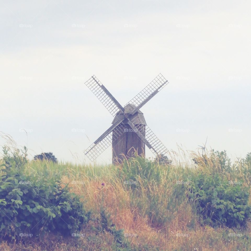 Windmill on a hill in the countryside 