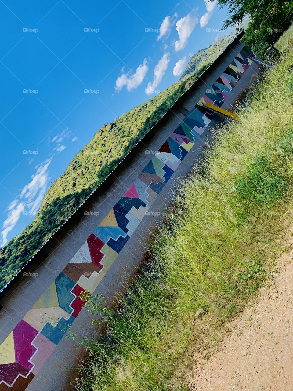 A colorfully painted classroom wall. Painted with geometric shapes and patterns.