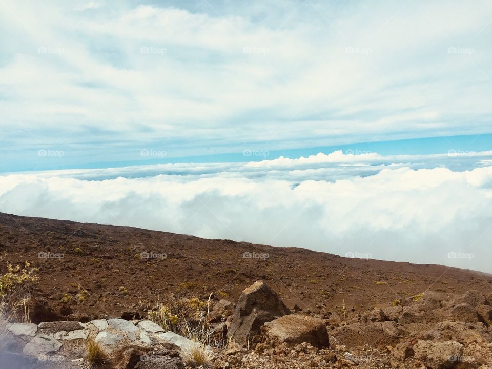 Above clouds top of the volcano 