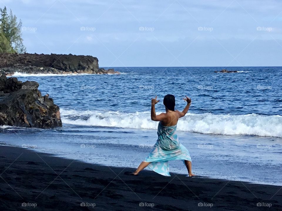 Yoga on the black sand