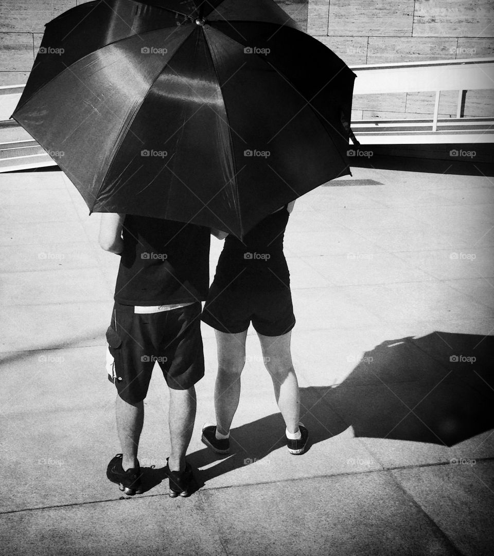 Couple protected by an umbrella