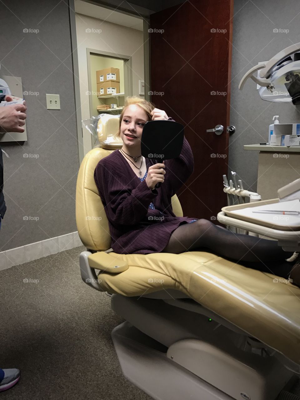 Cute girl smiling in dental clinic