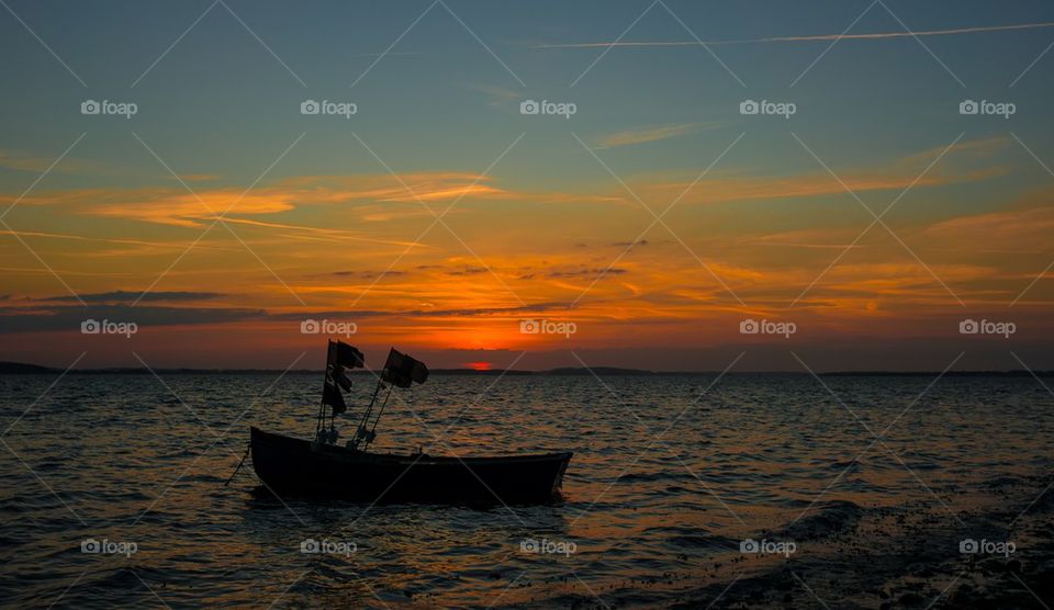 Silhouette of boat during sunset