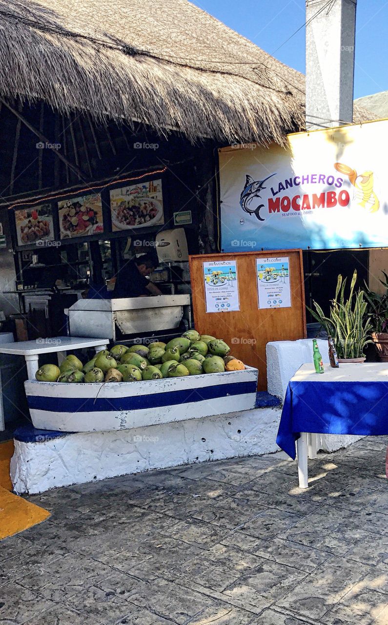 Rinky dink shops and fresh coconuts line the streets 