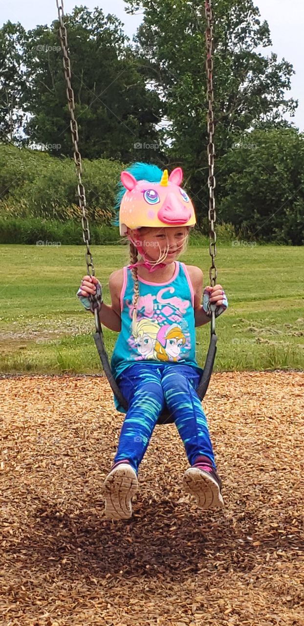swing, child, park, outdoors, summer fun, girl, swinging, MN, unicorn helmet