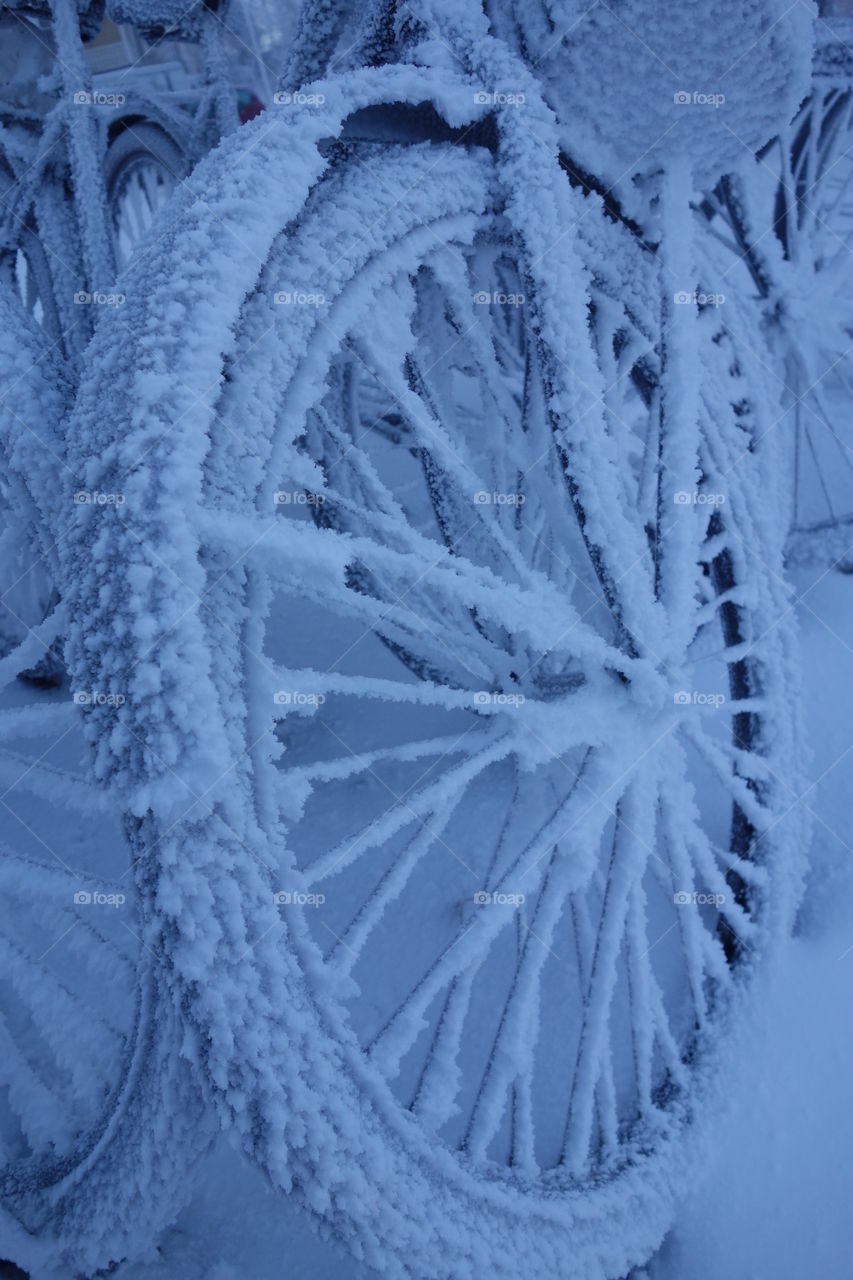 Frozen bicycle on extremely cold winter morning in Helsinki, Finland