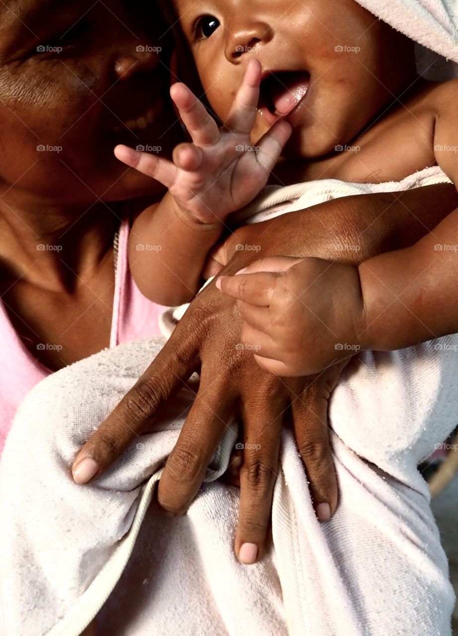 Mum's Hands:Holding her baby in factory