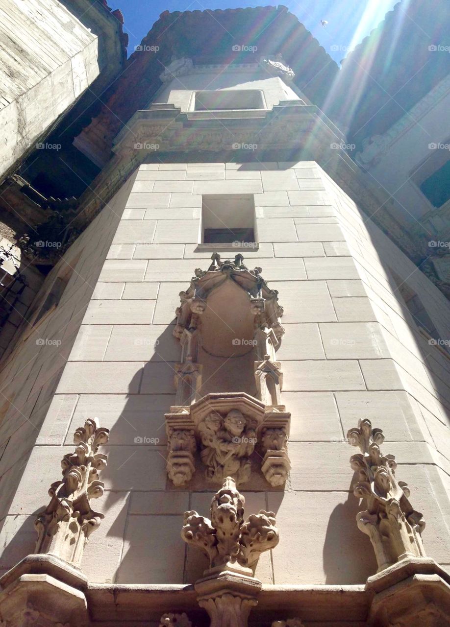 Looking Up in Doorway. Carvings and architecture of Hearst Castle above a door.