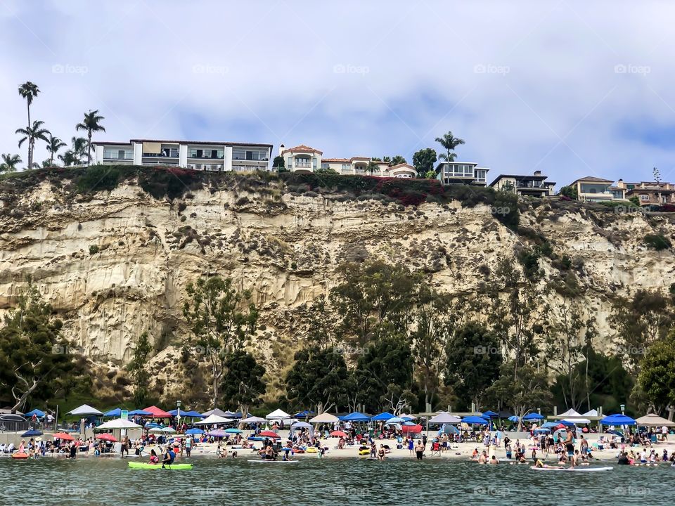 Foap Mission Landscape Beauty! Beach Crowed With Colorful Umbrellas At the Base Of Sand Cliffs Along the Southern California Coastline 