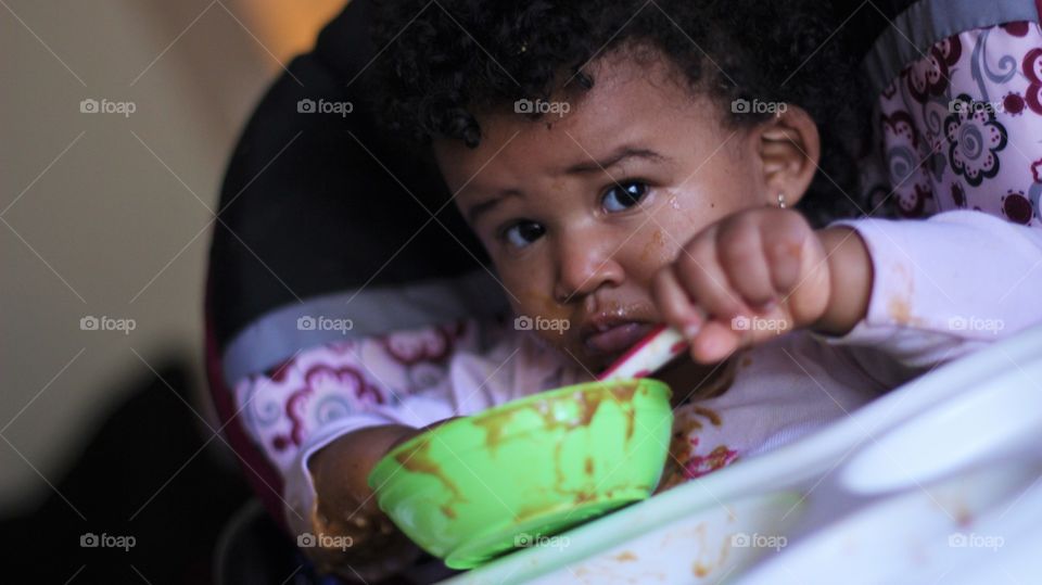 Close-up of african girl eating chocolate
