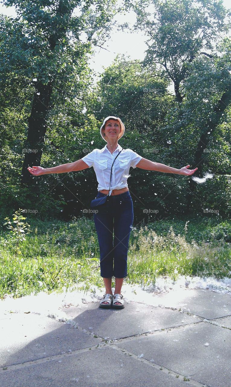 girl rejoices in poplar fluff